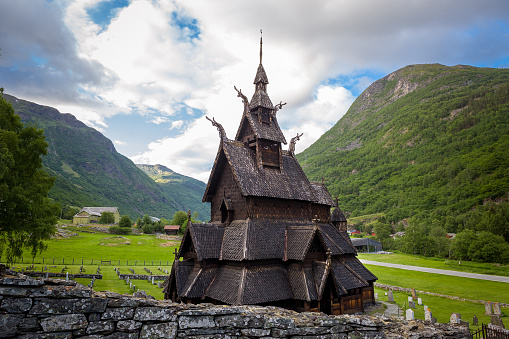 Borgund Stave Church and mountain range at background. One of the oldest Norwegian wooden churches.