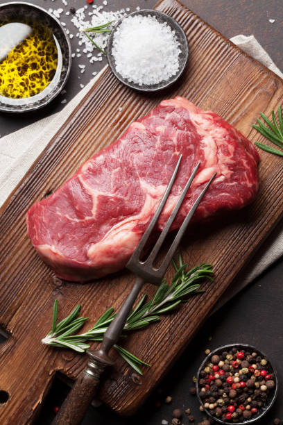 istock Raw ribeye beef steak cooking with ingredients 655840108