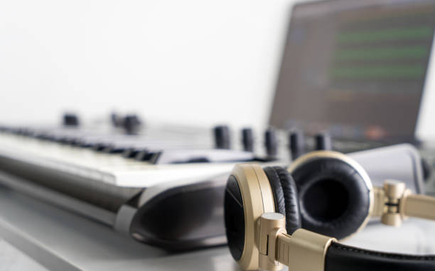 istock Golden Music Studio headphone with Computer music producing equipment. 655840276