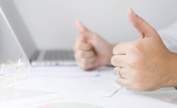 istock Business man in office is optimistic with two thumbs up 655840616