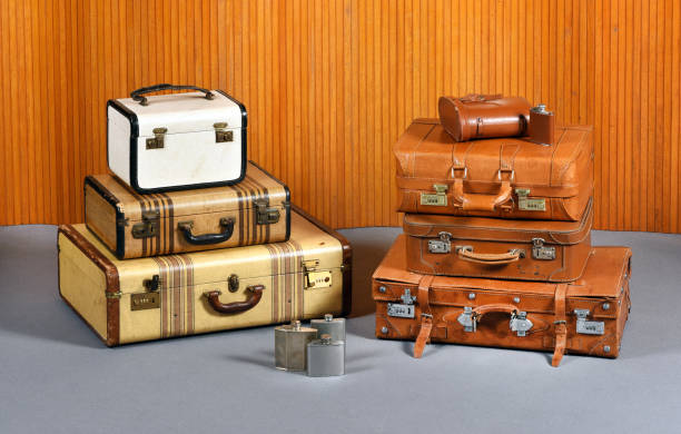 istock Stacks of Antique Suitcases and Drinking Flasks 655846978