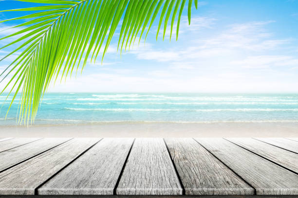 istock old wood table top on blurred beach background. 655847008
