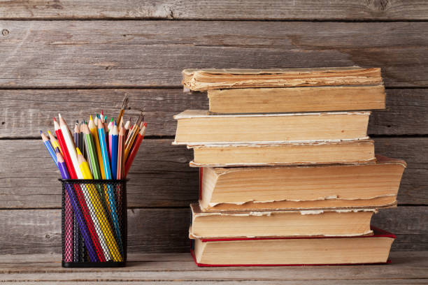 istock Old books and colorful pencils 655847742