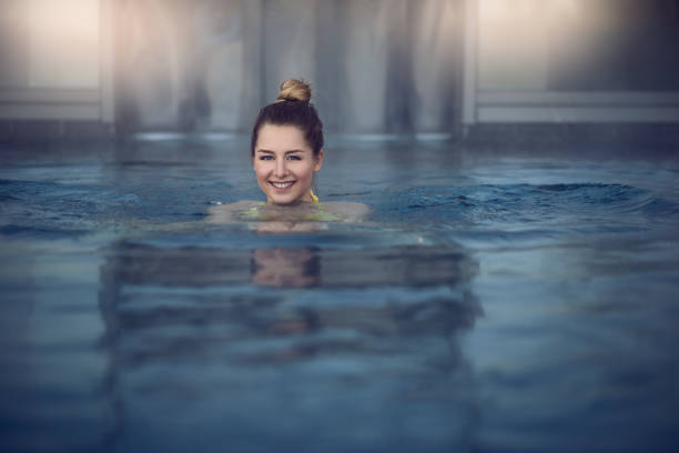 istock Woman swimming in the pool 655856834