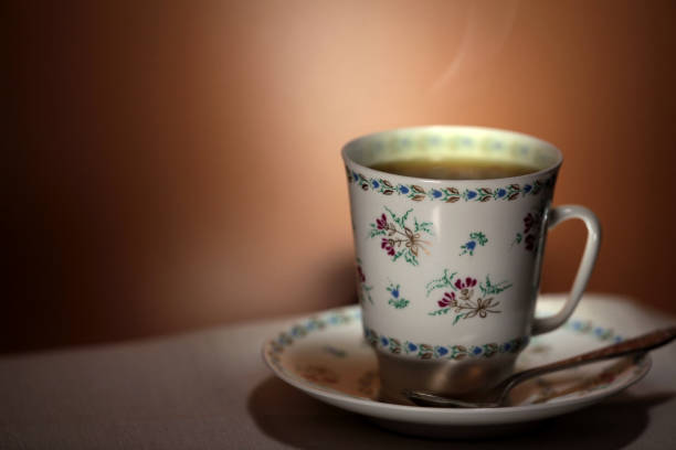 istock cup with hot tea and steam on background 655858072