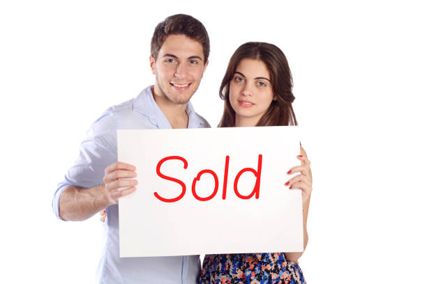 istock Couple holding cardboard with 