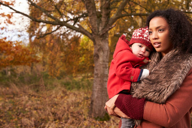 istock Young Girl On Autumn Walk With Mother 655867826