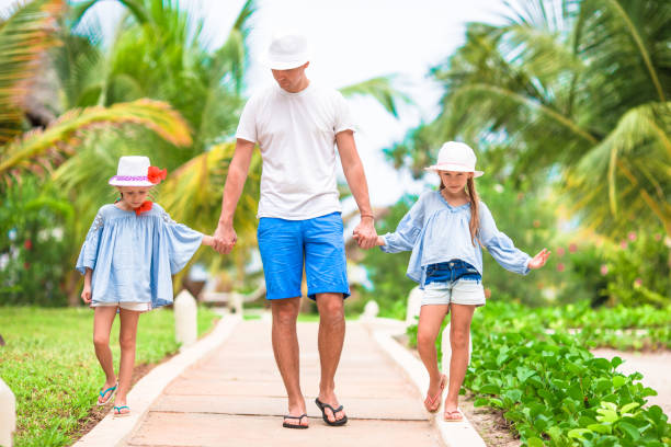 istock Happy family at tropical vacation having fun 655868404
