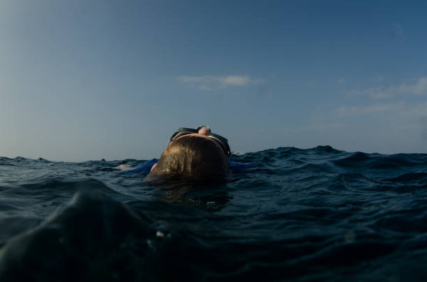 istock Child taking a break from swimming while floating on the water 655869298