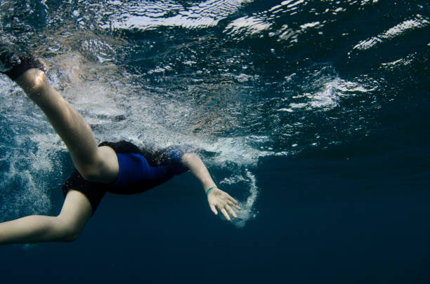 istock Child swimming under the ocean 655869306