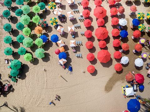 Lounge chairs and umbrellas in beach