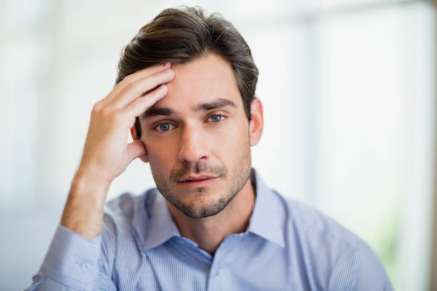 istock Worried businessman with hand on head 655887894