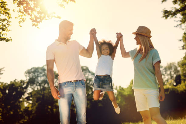 istock Playful family having fun outdoors and walking 655894010