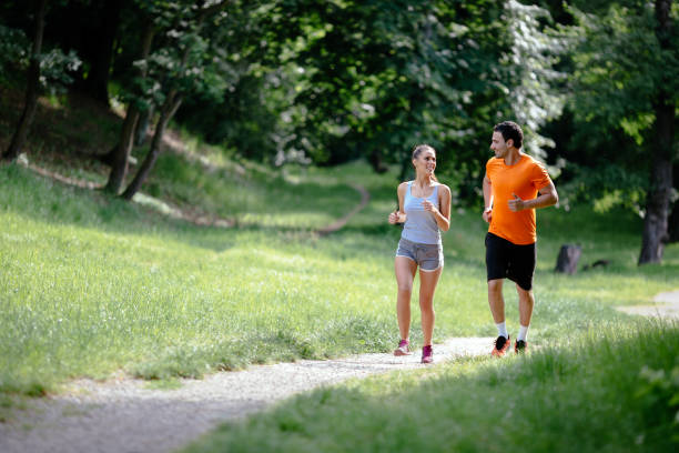 istock Couple jogging and running outdoors in nature 655896186