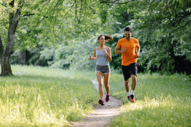 istock Couple jogging and running outdoors in nature 655896538