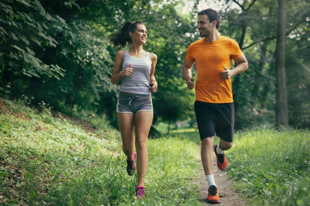 istock Couple jogging and running outdoors in nature 655896860