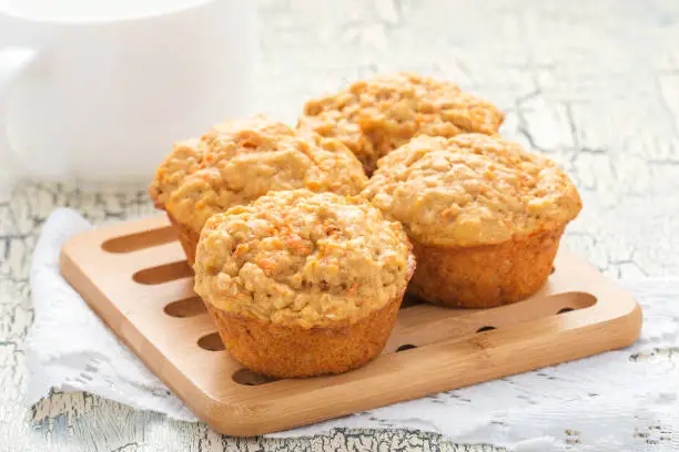 Delicious and homemade carrot oatmeal muffins photographed closeup.