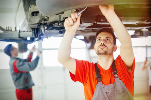 istock Car mechanics working on car maintenance 655909592