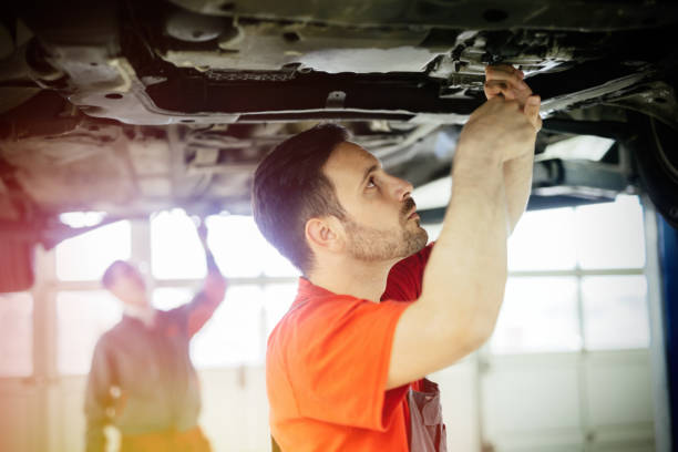 istock Car mechanics working on car maintenance 655909628