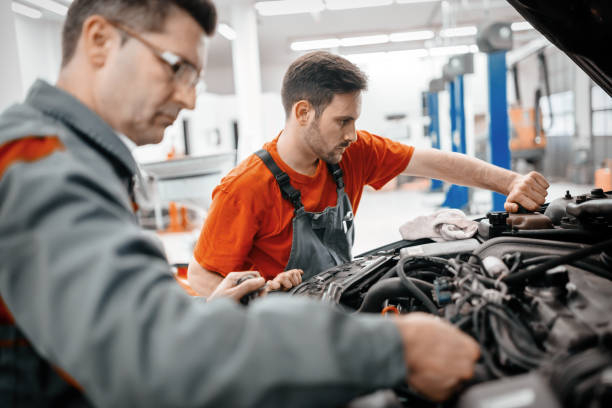 istock Car mechanics working on car maintenance 655909758