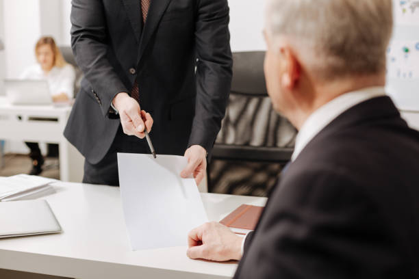 istock Involved employer signing the document in the office 655909824