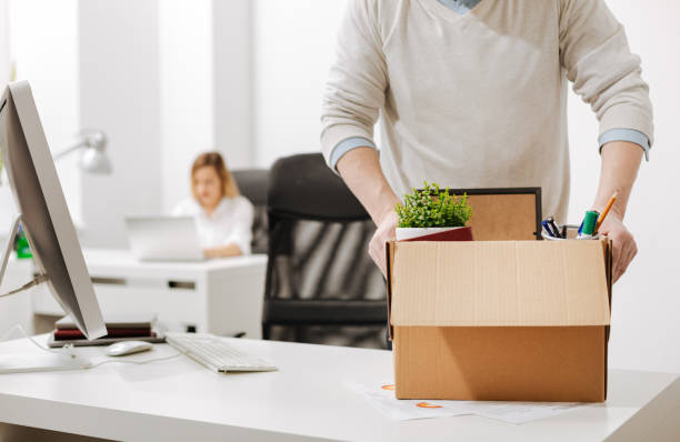 istock Bemused office manager packing the box and leaving the office 655916602