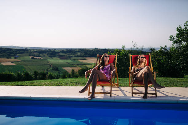 istock Beautiful women relaxing and sunbathing in summer 655917276