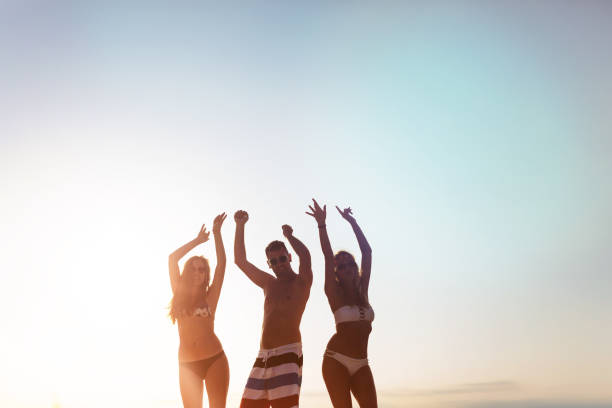 istock Young friends partying by the pool in summer 655917364
