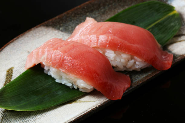 istock tuna sushi set on black background 655922782