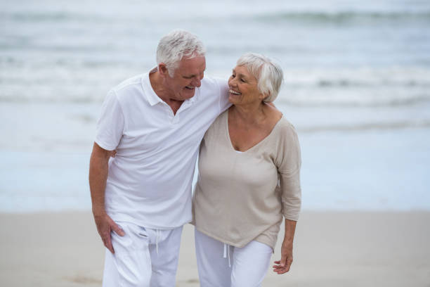 istock Senior couple embracing each other on the beach 655926538