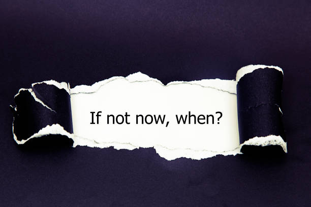 istock If Not Now When, appearing behind torn paper. 655927514