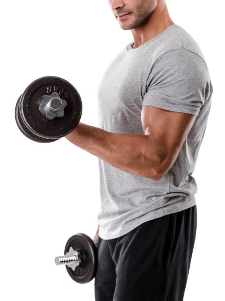 Athletic man lifting weights Portrait of a muscular man lifting weights, isolated over a white background water athlete competitive sport vertical stock pictures, royalty-free photos & images