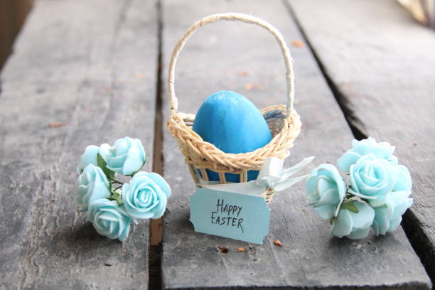 istock Happy easter. Easter egg in a basket on a vintage background and spring flowers.. 655928376