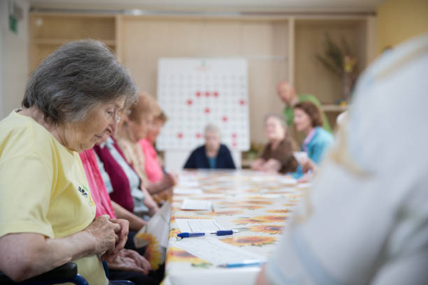 istock Seniors In The Retirement Community Socializing By Playing Bingo 655933884