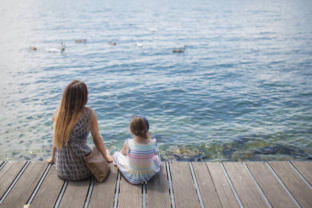 istock Mother and daughter on the sea 655934008
