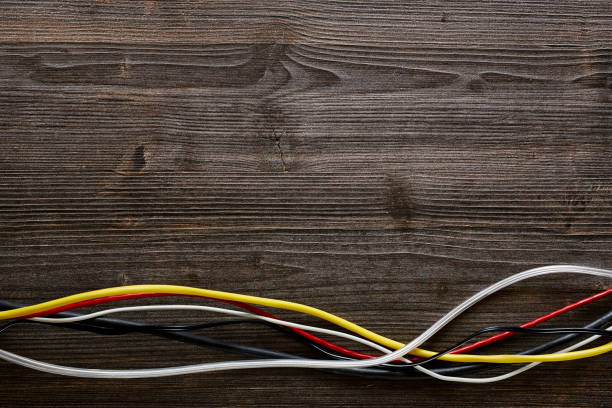 istock colorful cables mixed on dark wood 655937906
