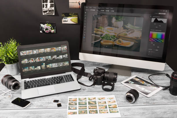 Photographers computer with photo edit programs. photographer photographic photograph journalist camera traveling photo dslr editing edit hobbies lighting concept NOTE TO INSPECTOR: All visible photos were produced for this particular shoot. I am the author of everything that you see in the image (interface program on the screen - property release added). photo editing screen stock pictures, royalty-free photos & images