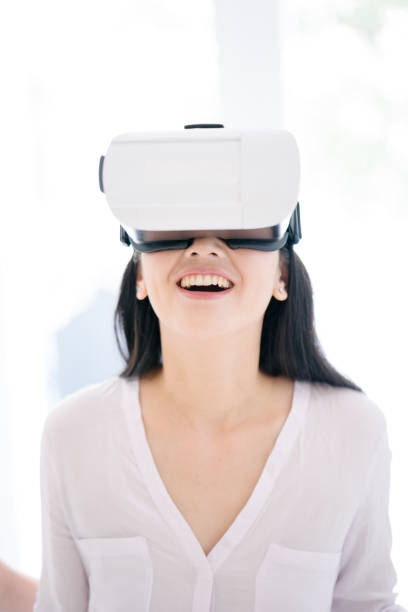 istock Woman wearing virtual reality headset 655944748