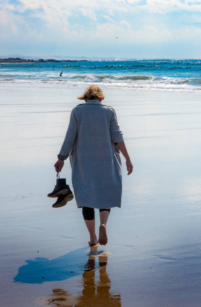 istock Young woman looking at the sea 655947792