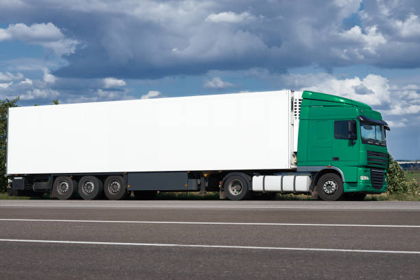 istock Truck on road with white blank container, blue sky, cargo transportation concept 655950834