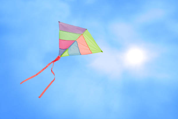 istock colorful kite flying with waving red bow 655953800
