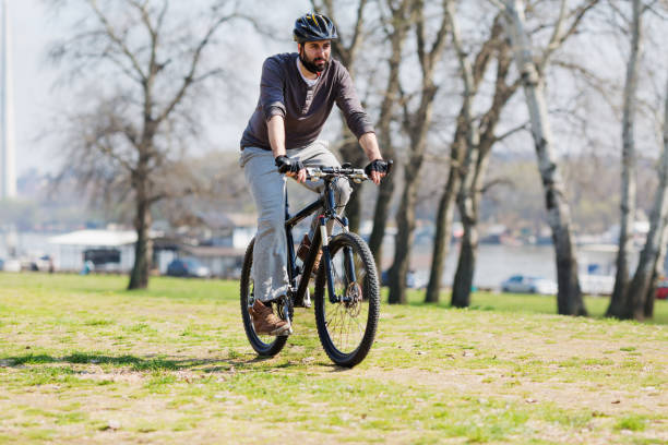 istock Man Riding a Bicycle on Nature Background 655966590