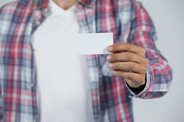 istock Man holding blank business card 655975934