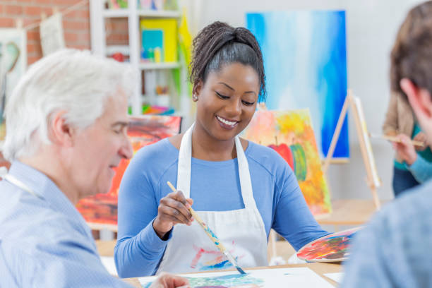 istock Friends paint together in art studio 655976162
