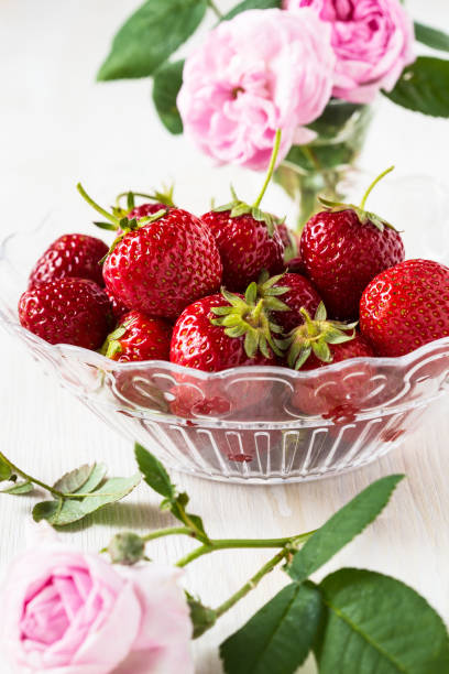 istock Romantic still life with  strawberries and pink roses 655976726
