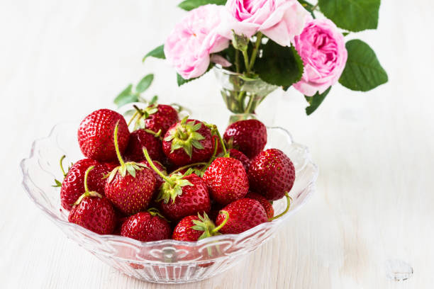 istock Romantic still life with  strawberries and pink roses 655976756