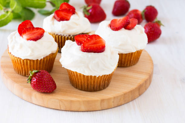 istock Homemade strawberry cupcakes with whipped cream 655978930