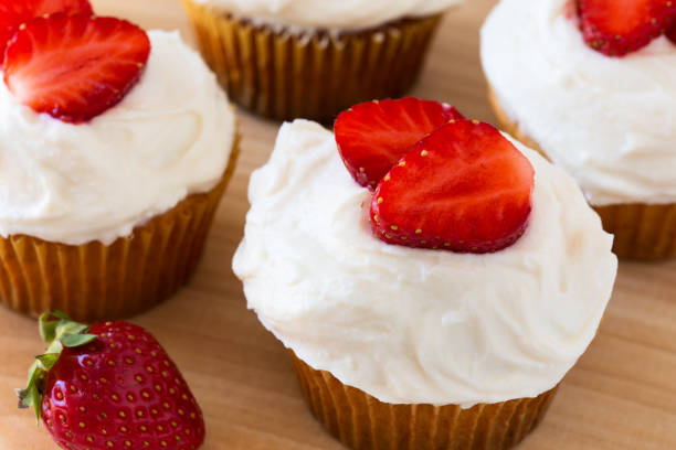 istock Homemade strawberry cupcakes with whipped cream 655979034