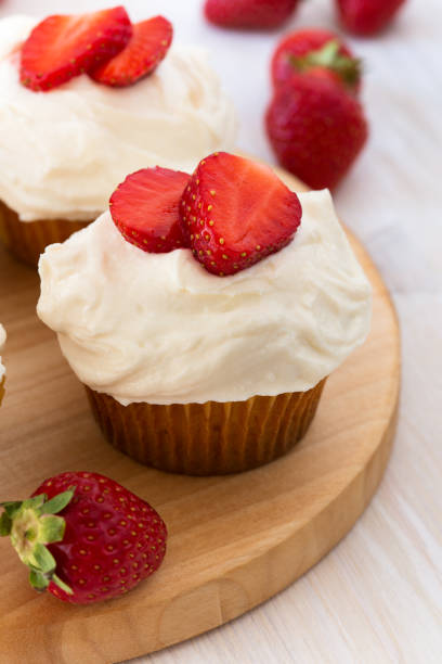 istock Homemade strawberry cupcakes with whipped cream 655979102