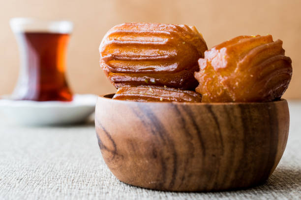 istock Turkish Dessert Tulumba tatlisi with tea. 655985914